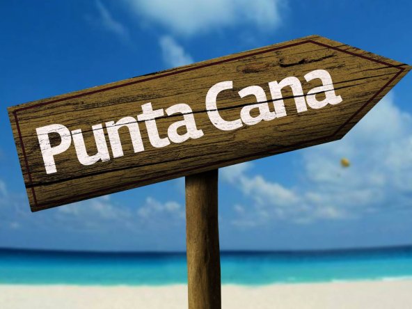 Punta Cana Beach with a sign. Punta Cana Real estate